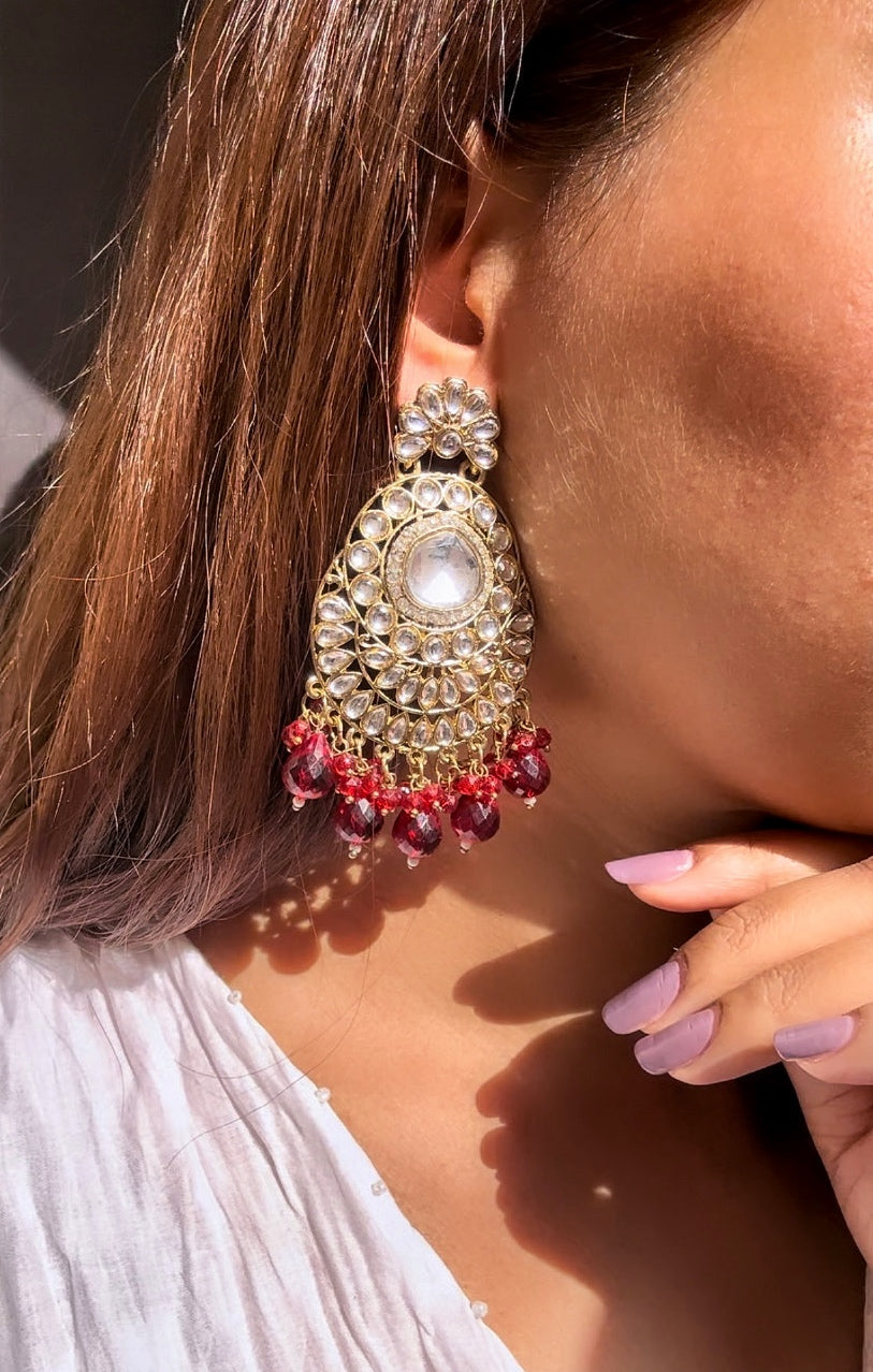 A beautiful traditional Kundan Earring with red beads by hvjewellery.in