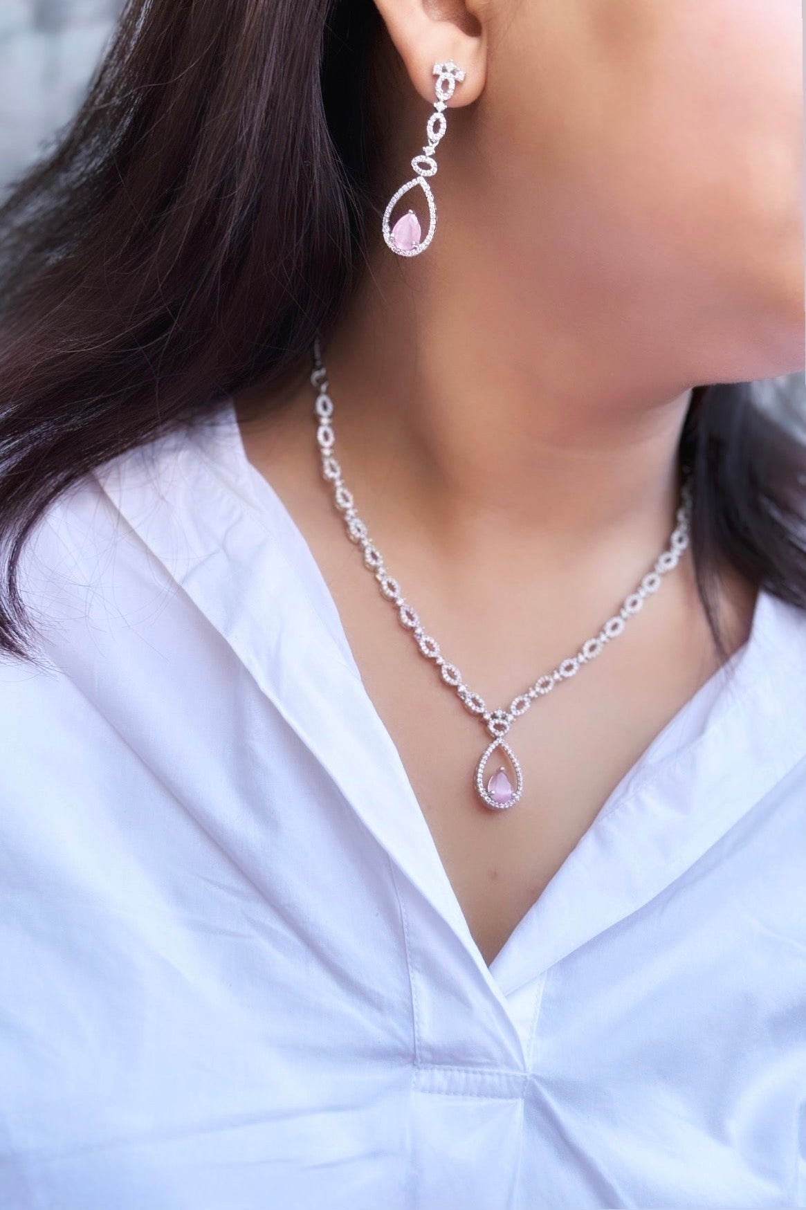 A diamond necklace with pink earring by hvjewellery.in