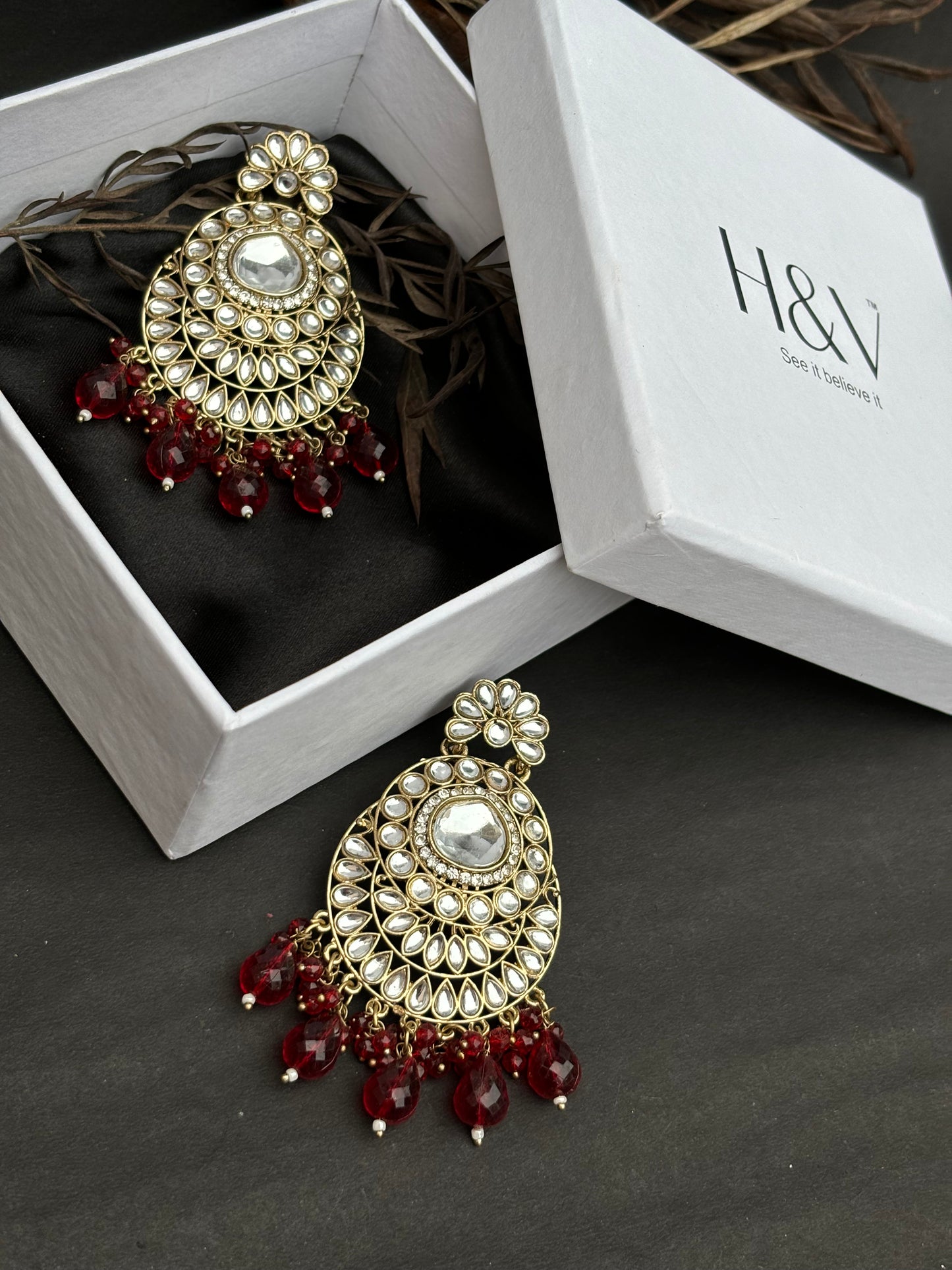 A beautiful traditional Kundan Earring with red beads by hvjewellery.in