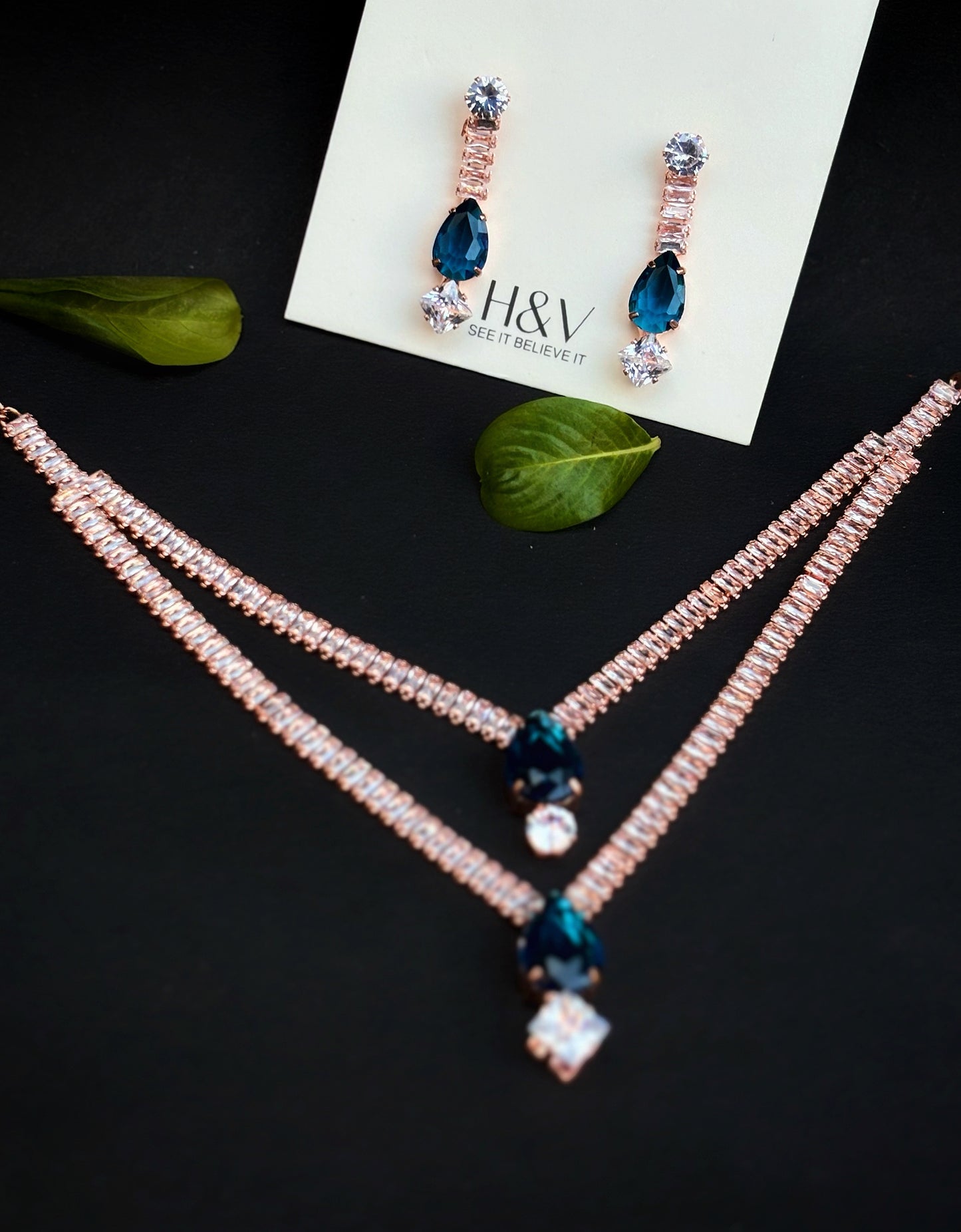 Rose gold with blue stone necklace set by hvjewellery.in