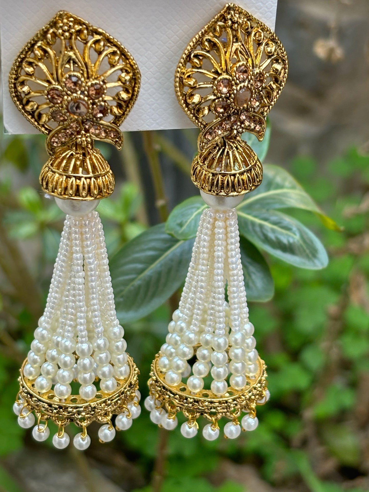 White colour with pearl long jhumki in gold finish by hvjewellery.in