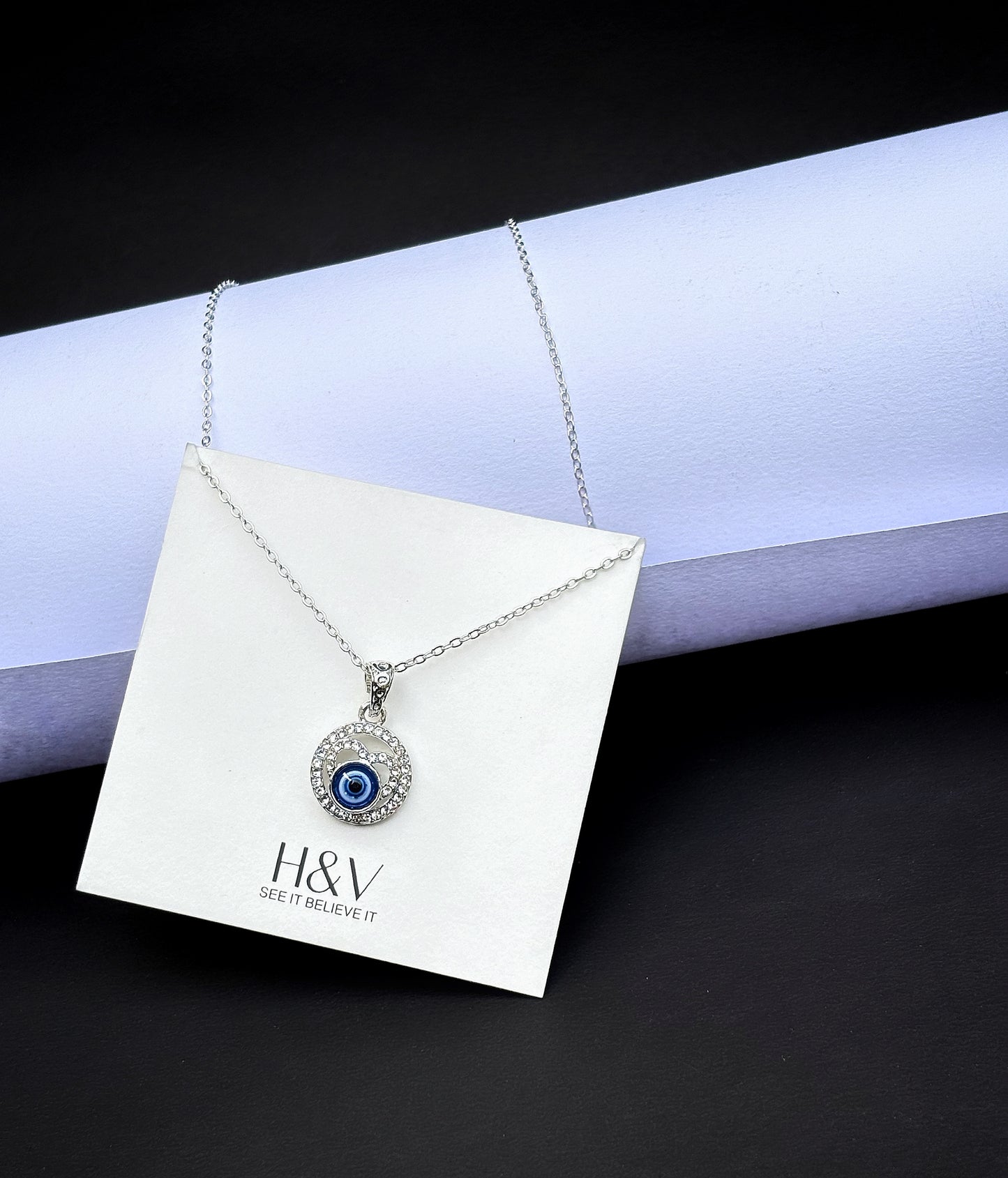 Tiny dark blue Evil eye pendant by hvjewellery.in