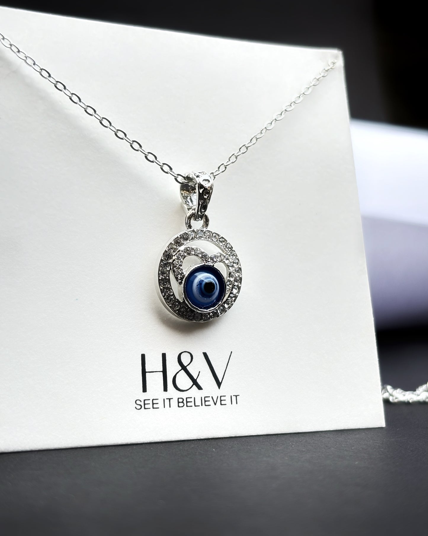 Tiny dark blue Evil eye pendant by hvjewellery.in