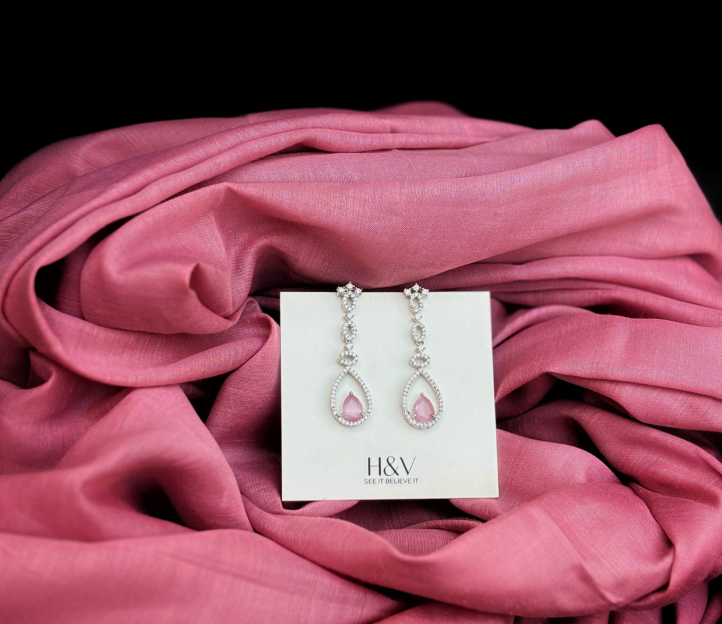 A diamond necklace with pink earring by hvjewellery.in