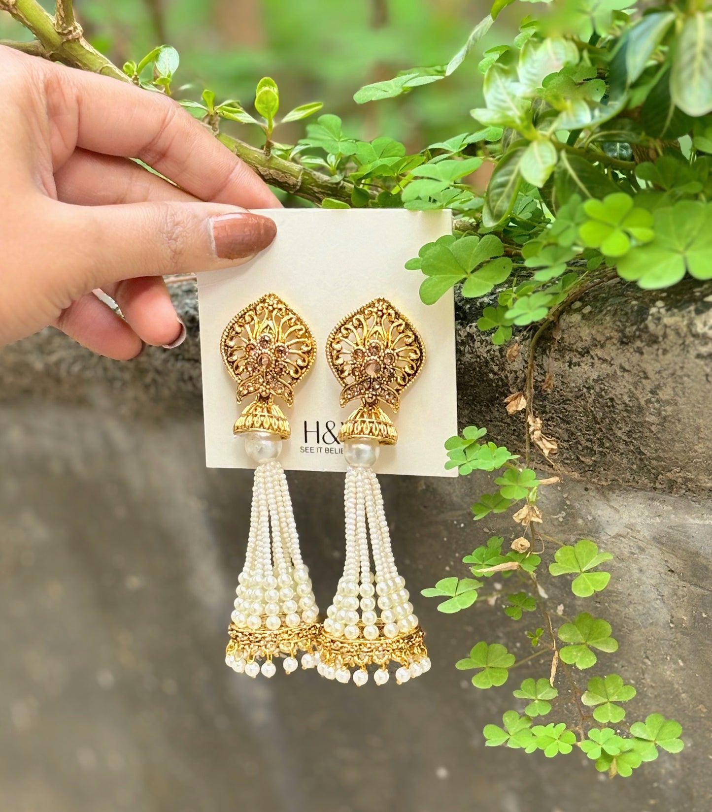 White colour with pearl long jhumki in gold finish by hvjewellery.in