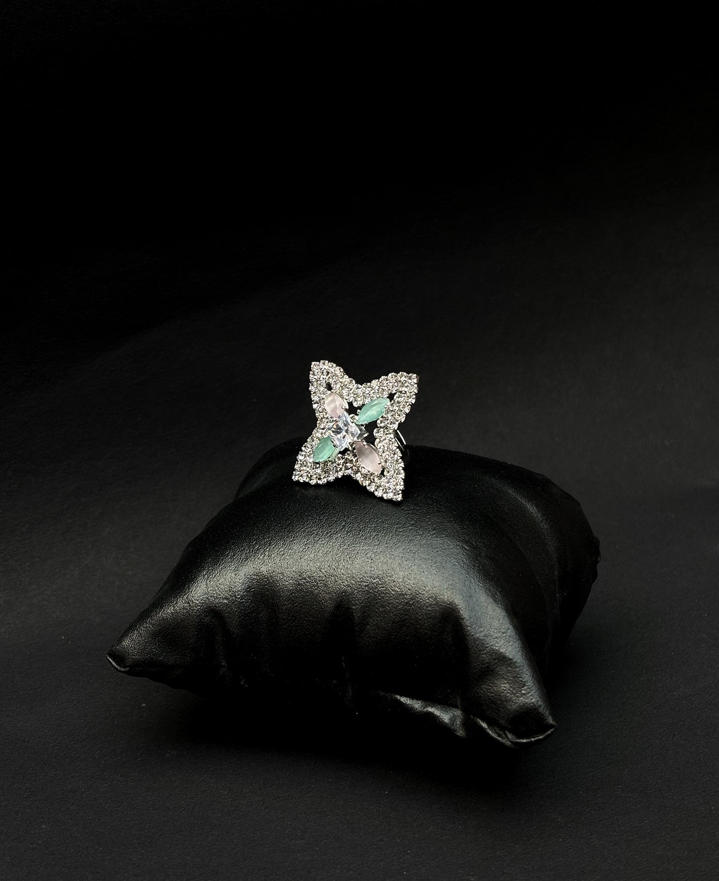 A diamond ring with a pink & green stone's star design by hvjewellery.in