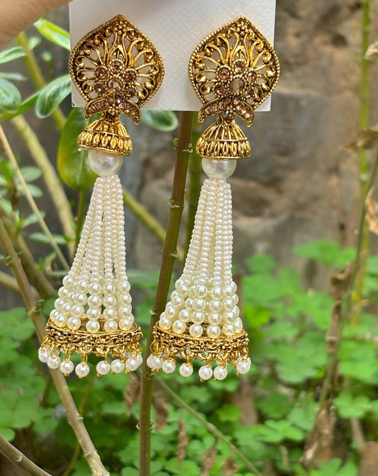 White colour with pearl long jhumki in gold finish by hvjewellery.in