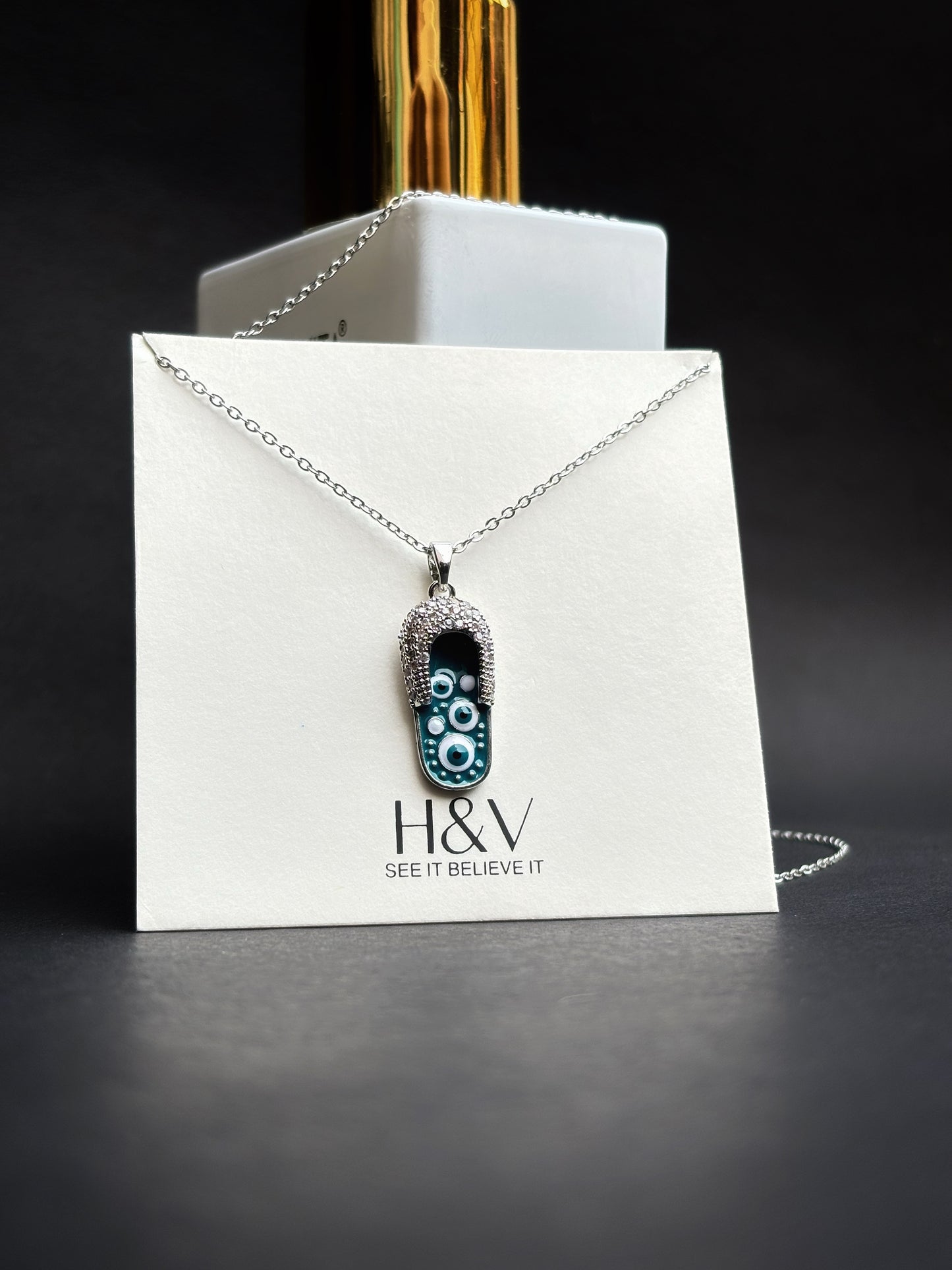 A Unique design slipper pendant by hvjewellery.in